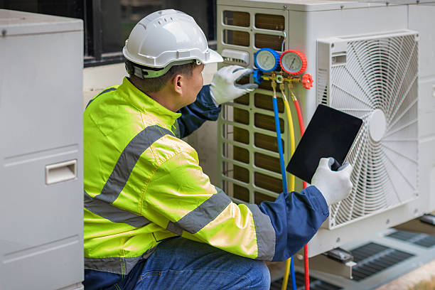Professional Hvac technician working in Point Clear, AL